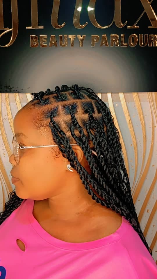 A satisfied hair styling client at Sifmax Beauty Parlour Dar es Salaam